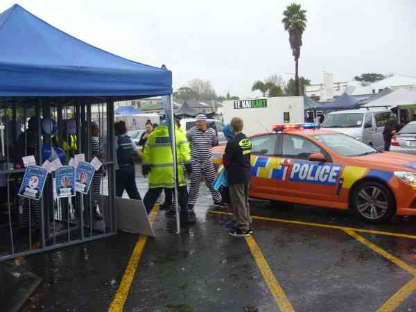 The prisoners are brought go the temporary lock-up in front of The Warehouse